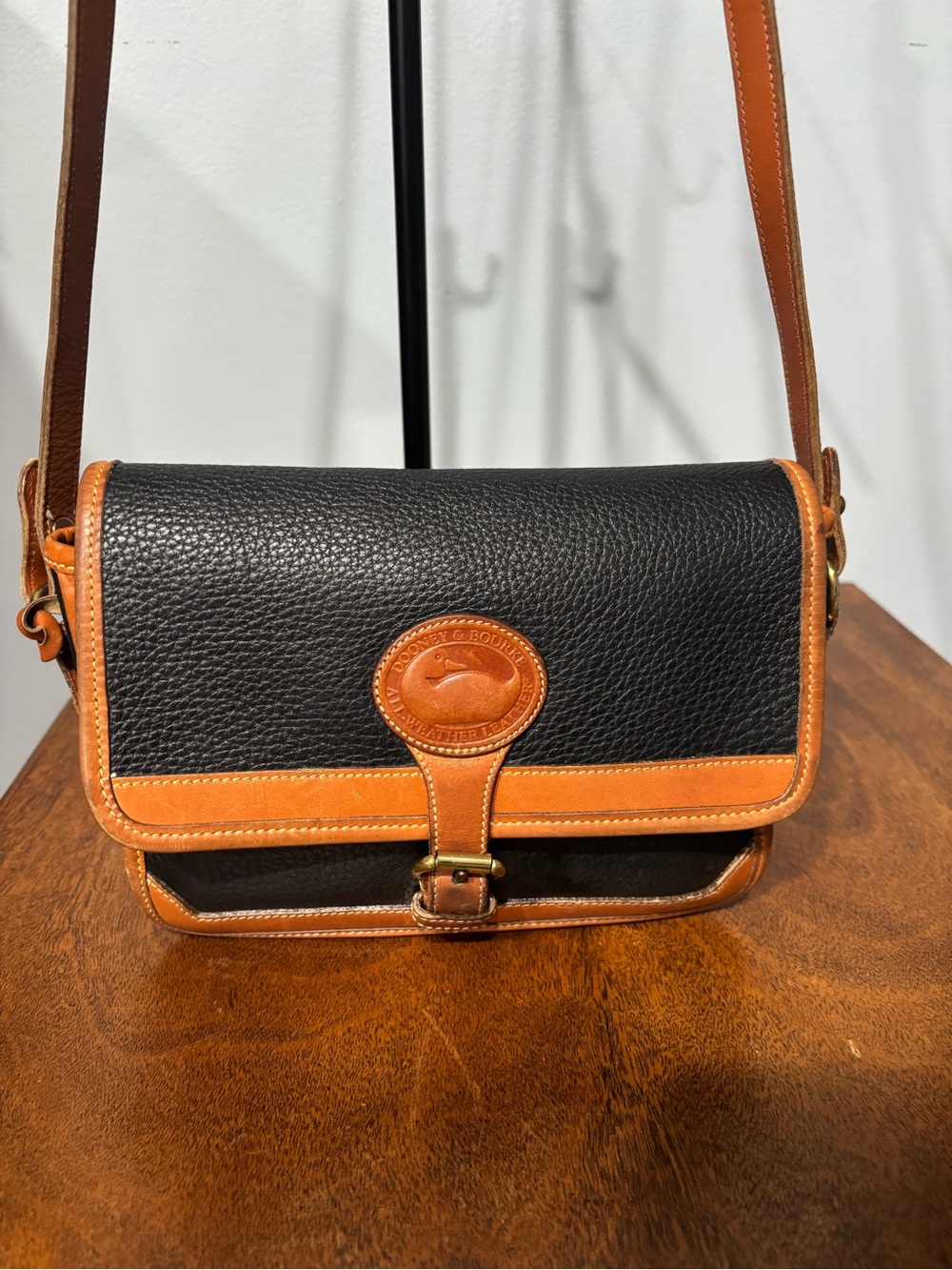 Dooney & Bourke Black and Tan Pebbled Leather Shoulder Bag